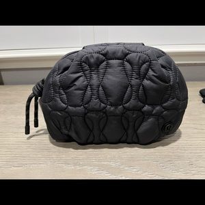 Brand new with tags. Black quilted embrace pouch.